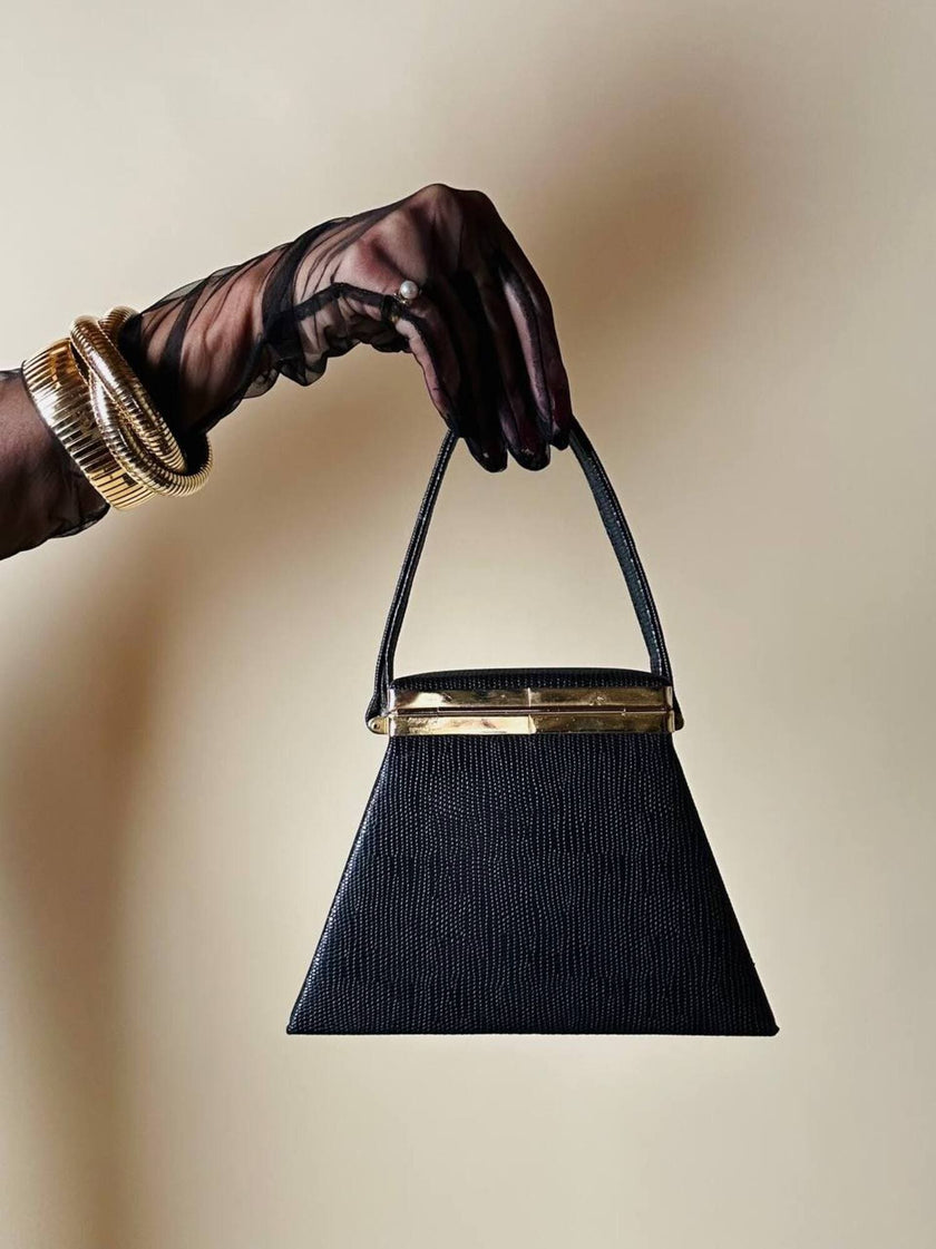 Mini bag a trapezio in ecopelle nera stampa lizard
