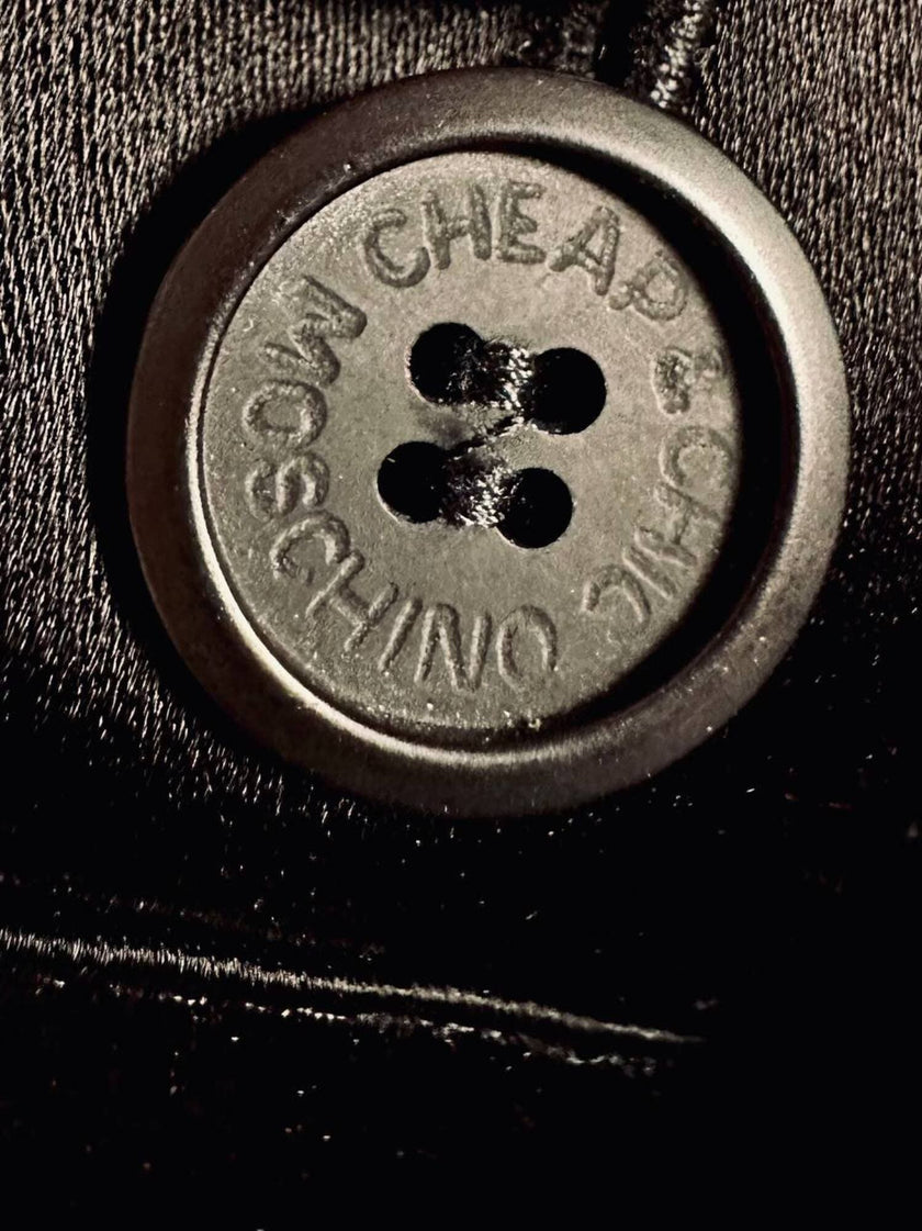Pantalone nero con bretelle e maxi fiocchi in raso “Moschino Cheap and Chic”
