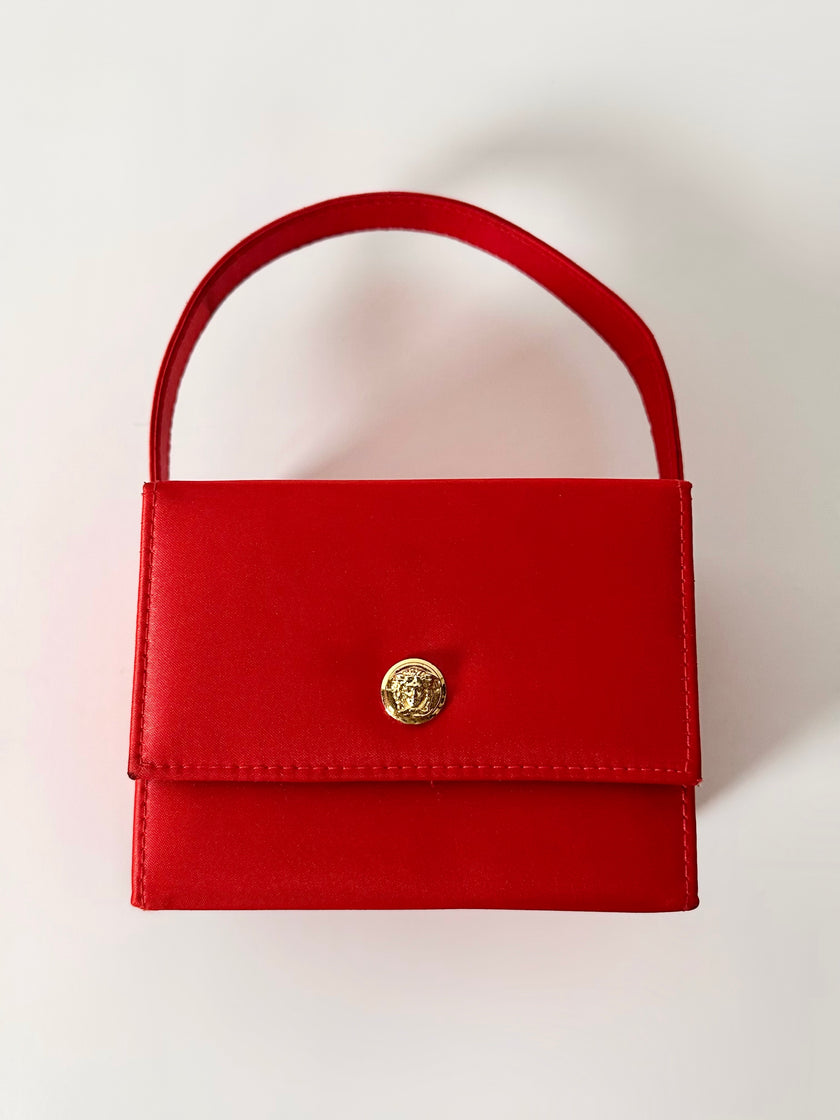 Mini bag vintage Versace Profumi in raso rosso con borchia medusa