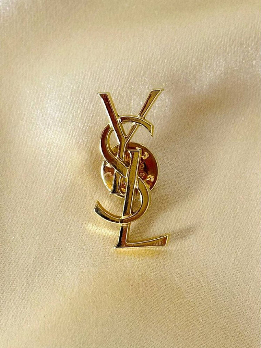 Spilla logo Yves Saint Laurent color oro