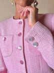Blazer in lana bouclé rosa con bottoni gioiello logati in madreperla “Yves Saint Laurent”