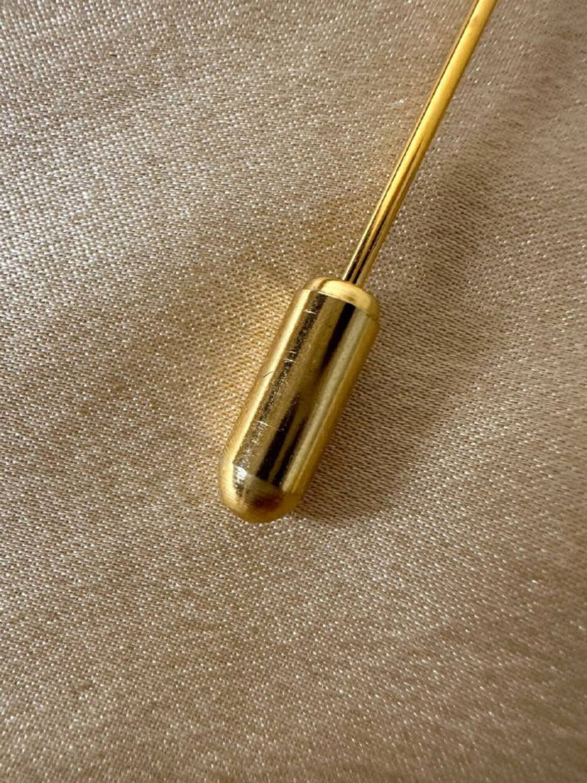 Spillone dorato con pepita “Yves Saint Laurent”