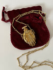 Collana vintage dorata con ciondolo a forma di bottiglia di profumo