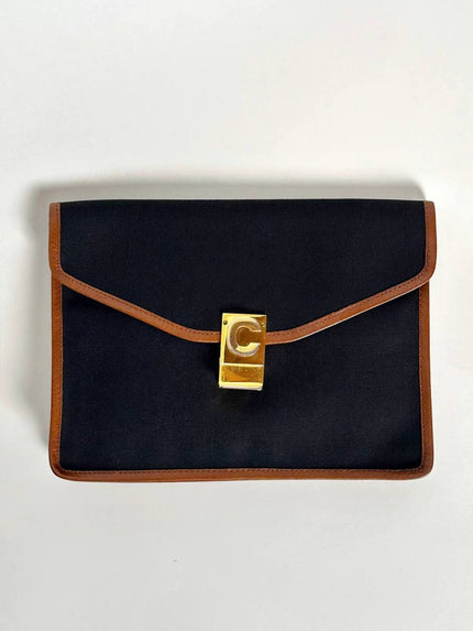Pochette vintage Celine modello a busta in canvas nero con profili in pelle tabacco