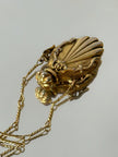 Collana vintage dorata con ciondolo a forma di bottiglia di profumo