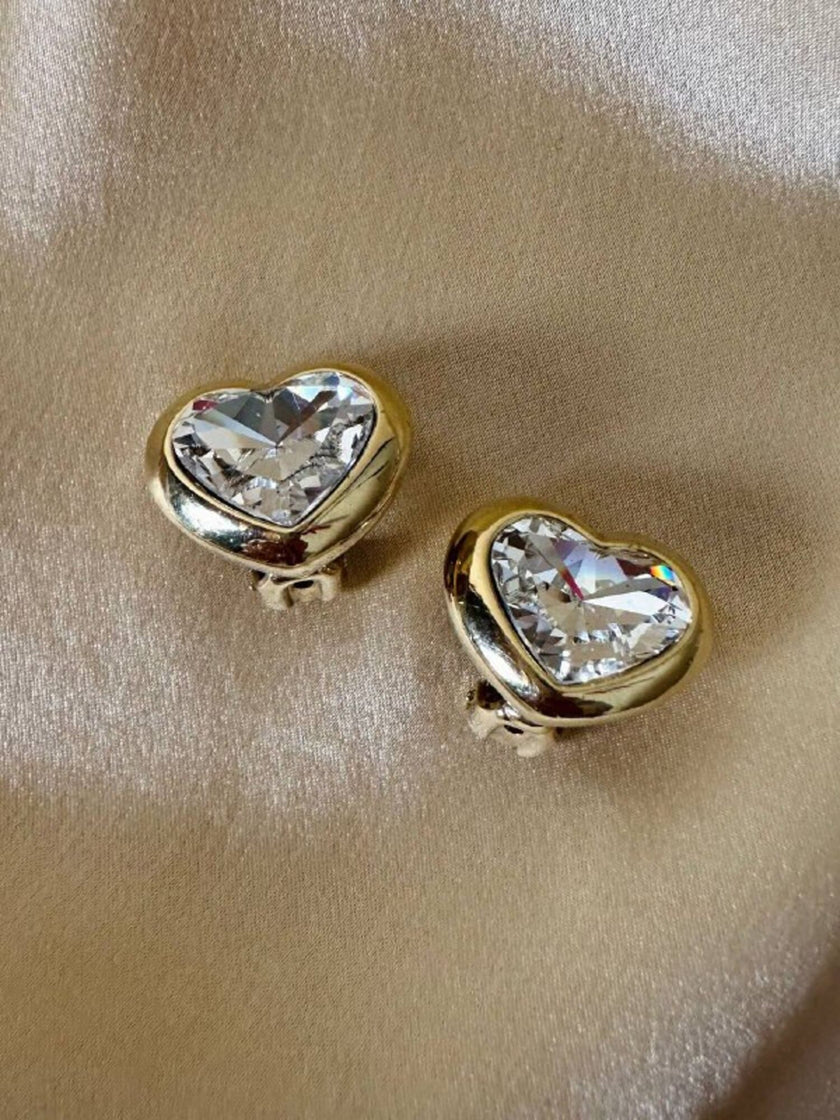 Clip dorate a forma di cuore con strass centrale