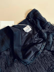Abito/gonna in crepe di seta nero con frange a balze