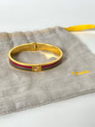 Bracciale vintage Fendi in metallo oro rifinito con smaltato grigio e rosso