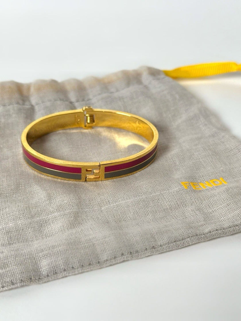 Bracciale vintage Fendi in metallo oro rifinito con smaltato grigio e rosso