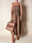 Borsa Yves Saint Laurent in canvas beige con profili color cuoio e motivo greca con logo