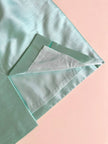 Tailleur giacca e gonna in shantung di seta acqua marina con bottoni gioiello “Escada”
