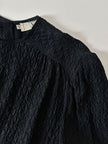 Blusa vintage Valentino Miss V in seta nera goffrata