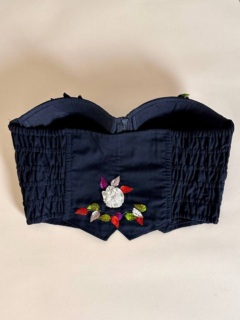 Bustier in cotone nero ricamato con fiori e paillettes e piccole coccarde multicolor “Giorgio Kauten”