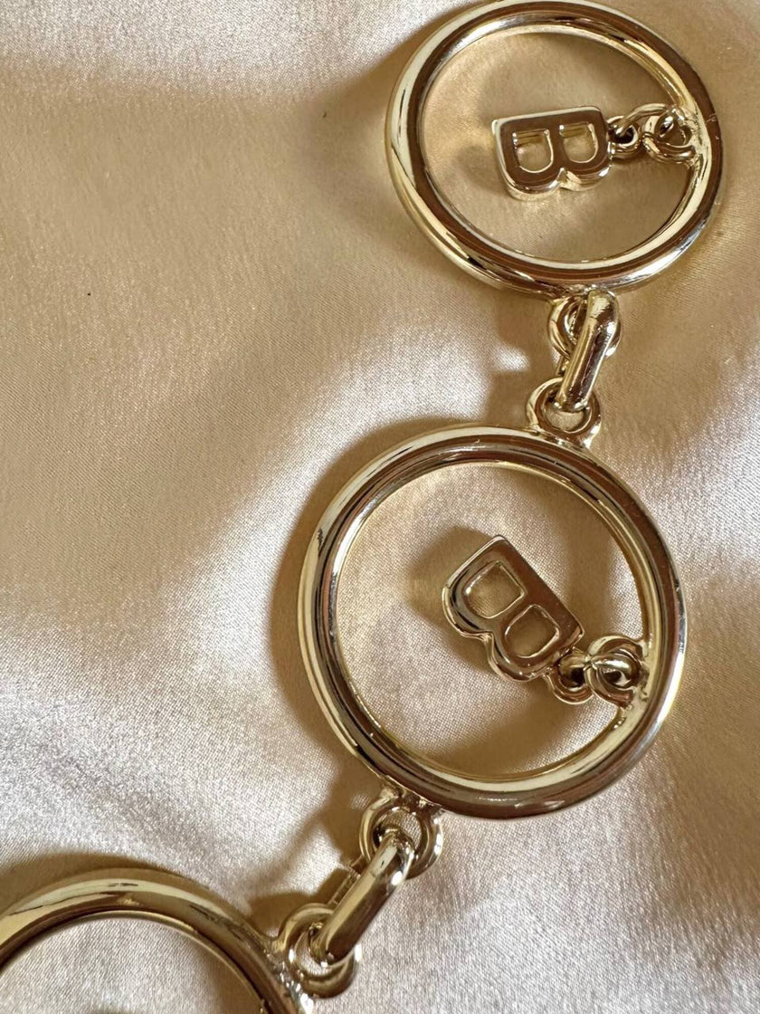Cintura dorata a catena con charm a forma di B “Blumarine”