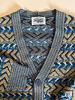 Cardigan Missoni Sport con pattern geometrico e trama tridimensionale nei toni del verde e blu