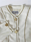 Giacca vintage Yves Saint Laurent bianco latte con serpentine dorate e bottoni gioiello
