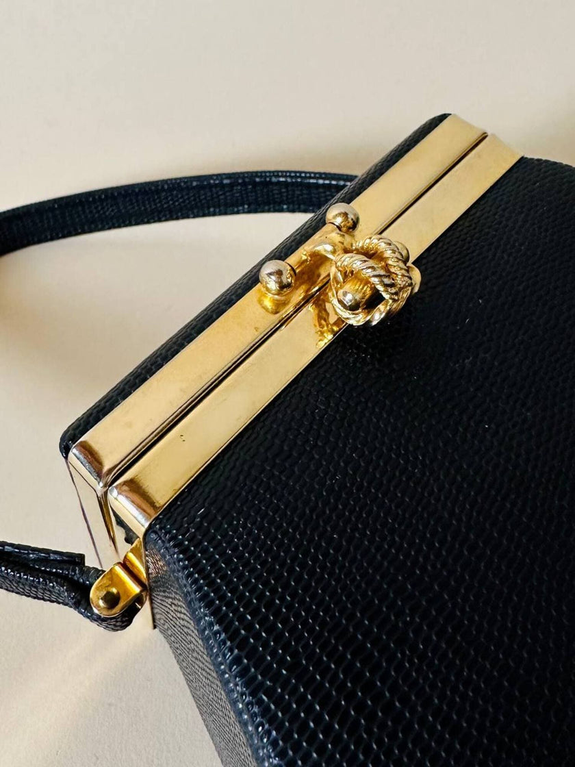 Mini bag a trapezio in ecopelle nera stampa lizard