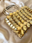 Mini bag gioiello a medaglie dorate