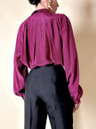 Camicia in seta a quadretti fucsia e neri con con fiocco al collo “Valentino”