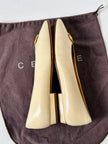 Ballerine vintage Celine Paris in pelle avorio con medaglioni dorati logati