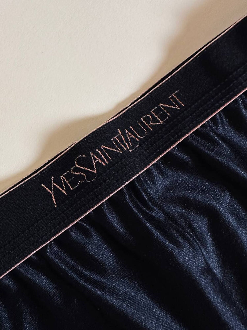 Collant vintage Yves Saint Laurent in lycra lucida nera con elastico logato