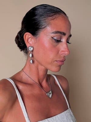 Collier argento con ciondolo a forma di cuore e cristalli incastonati “Yves Saint Laurent”