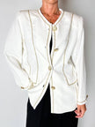 Giacca vintage Yves Saint Laurent bianco latte con serpentine dorate e bottoni gioiello