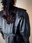 Biker vintage in pelle nera con cintura in vita e fodera couture