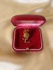 Spilla logo Yves Saint Laurent color oro