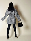 Collant vintage Yves Saint Laurent in lycra lucida nera con elastico logato