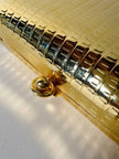 Mini clutch in metallo oro con tracolla in catena