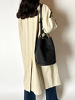 Secchiello vintage Yves Saint Laurent in tessuto nero millerighe con riporti in pelle
