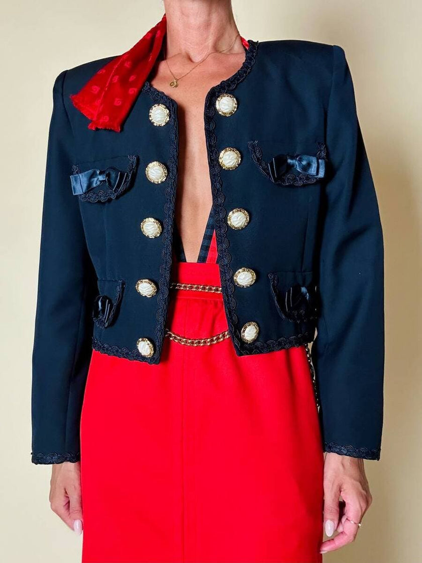 Bolero blu con bottoni gioiello e fiocchi “Max Dinè”