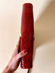 Pochette in whips rossa con tracolla regolabile