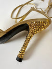 Décolleté slingback Gianni Versace in pelle laminata oro con punta affusolata lacci alla caviglia e tacco gioiello