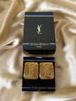 Maxi clip oro con logo “Yves Saint Laurent”