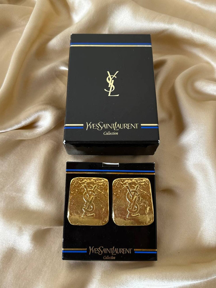 Maxi clip oro con logo “Yves Saint Laurent”