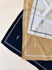 Foulard in seta nera con profili e logo bianchi  “Yves Saint Laurent”