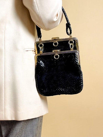 Mini bag artigianale in pitone nero con fodera rossa