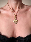 Collana dorata con ciondolo pendente a cuoricini “Yves Saint Laurent”