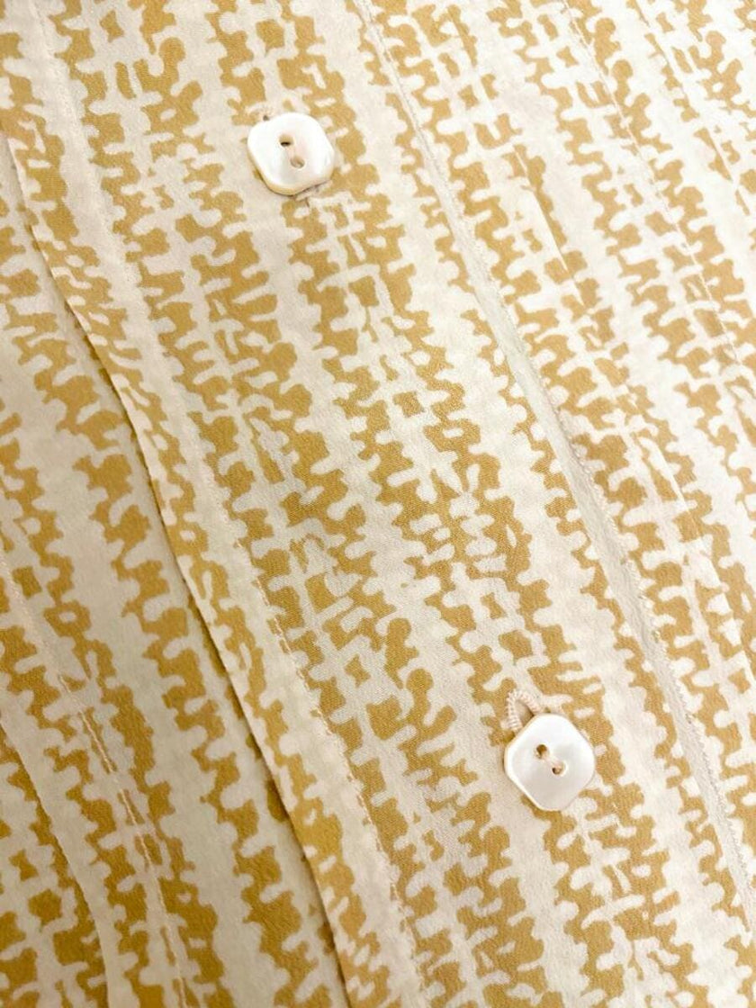 Camicia sartoriale in seta panna fantasia beige con nastro a collo