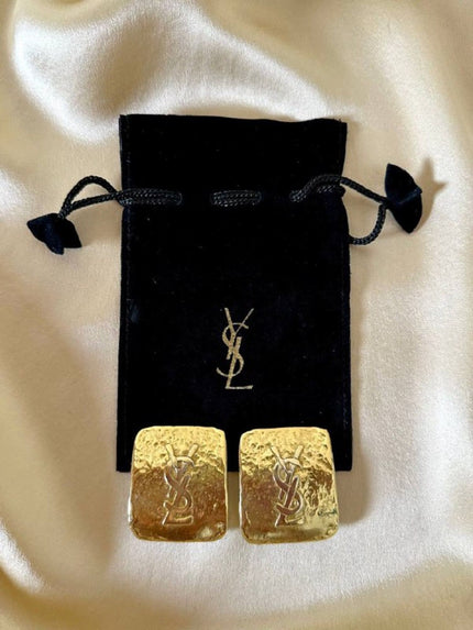 Maxi orecchini a clip dorati con logo YSL 