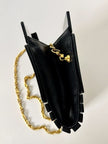 Borsa vintage Fendi in lucite nera con logo inciso e tracolla a catena dorata