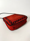 Borsa vintage Yves Saint Laurent in camoscio rosso con passamaneria nera