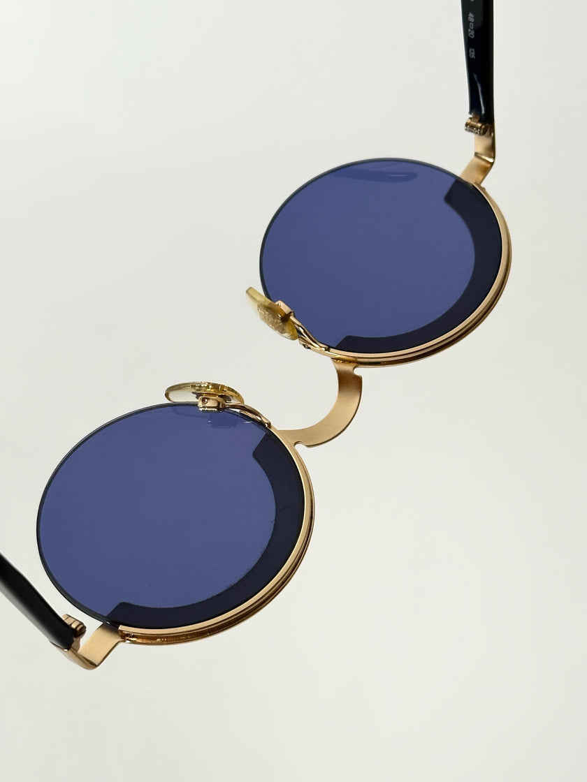 Occhiali da sole vintage Oliver Valentino con montatura gioiello dorata e lenti blu