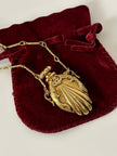 Collana vintage dorata con ciondolo a forma di bottiglia di profumo