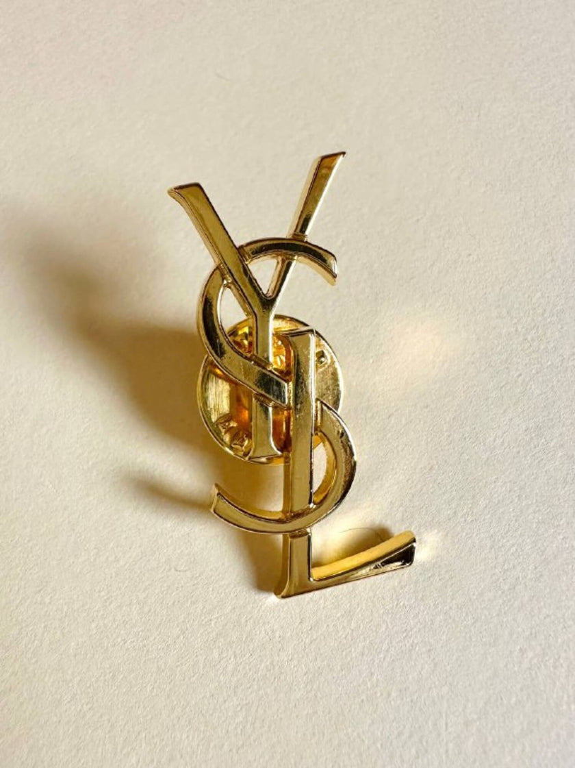 Spilla logo Yves Saint Laurent color oro