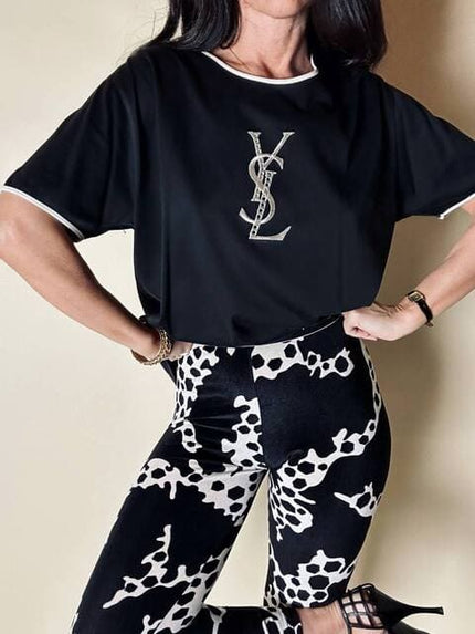 T-shirt vintage Yves Saint Laurent in cotone nero con logo YSL in lamé argento e strass