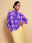 Blusa in seta lilla con maxi fiocco