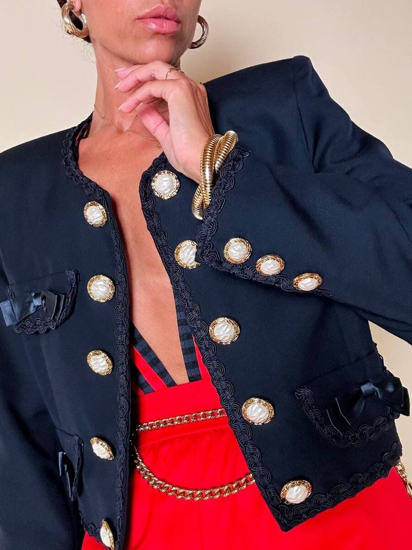 Bolero blu con bottoni gioiello e fiocchi “Max Dinè”